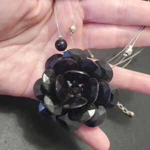 Silver tone black flower floating necklace 18-20"